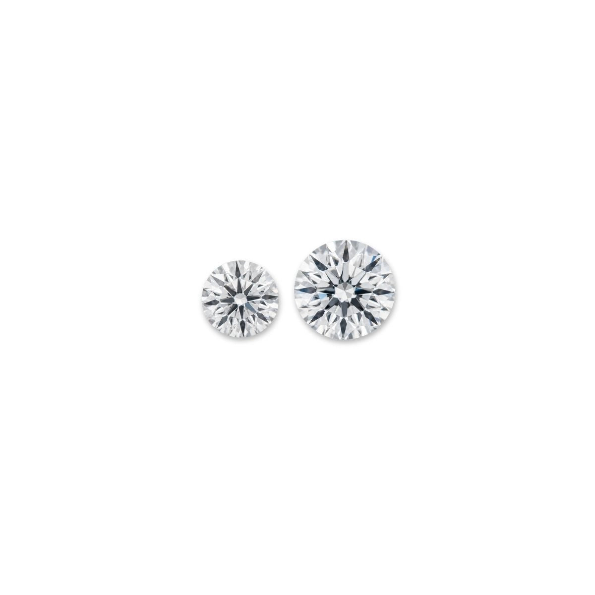 Two round diamonds of different sizes, representing carat weight as a measurement of diamond weight.