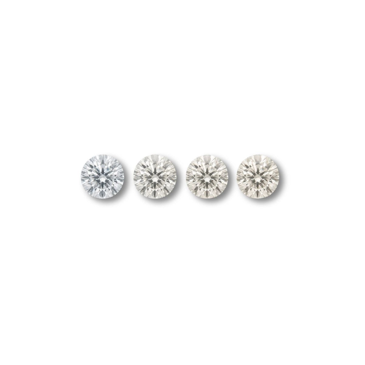 Row of round diamonds showing subtle color differences, representing how diamond color is evaluated under controlled grading conditions.
