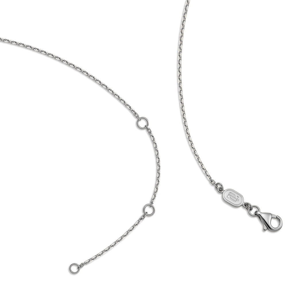 Detail view of the J'ENCHANTE 18K white gold adjustable chain necklace, showing the extender rings and lobster clasp on a white background.