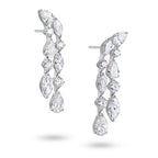 Side view of J'ENCHANTE Celeste Cascade 18K white gold diamond earrings, highlighting the pear-shaped drop diamonds, round accents and layered setting structure.