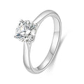J'ENCHANTE Classic 18K white gold lab-grown diamond solitaire ring, shown on a white background with a round center diamond and four-prong setting.