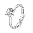 J'ENCHANTE Classic 18K white gold lab-grown diamond solitaire ring, shown on a white background with a round center diamond and four-prong setting.