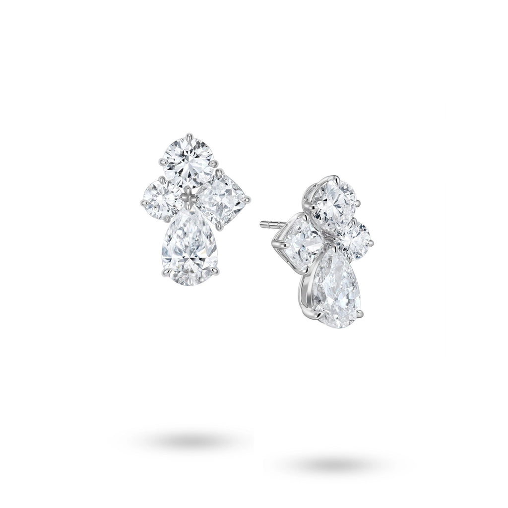 J'ENCHANTE Luminous Poise 18K white gold diamond earrings, shown with one front view and one side view highlighting the pear-shaped drop diamond and sculptural setting details.