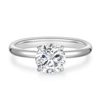 Front detail view of the J'ENCHANTE Petite 18K white gold lab-grown diamond ring, highlighting the round center diamond, four-prong setting and polished band.