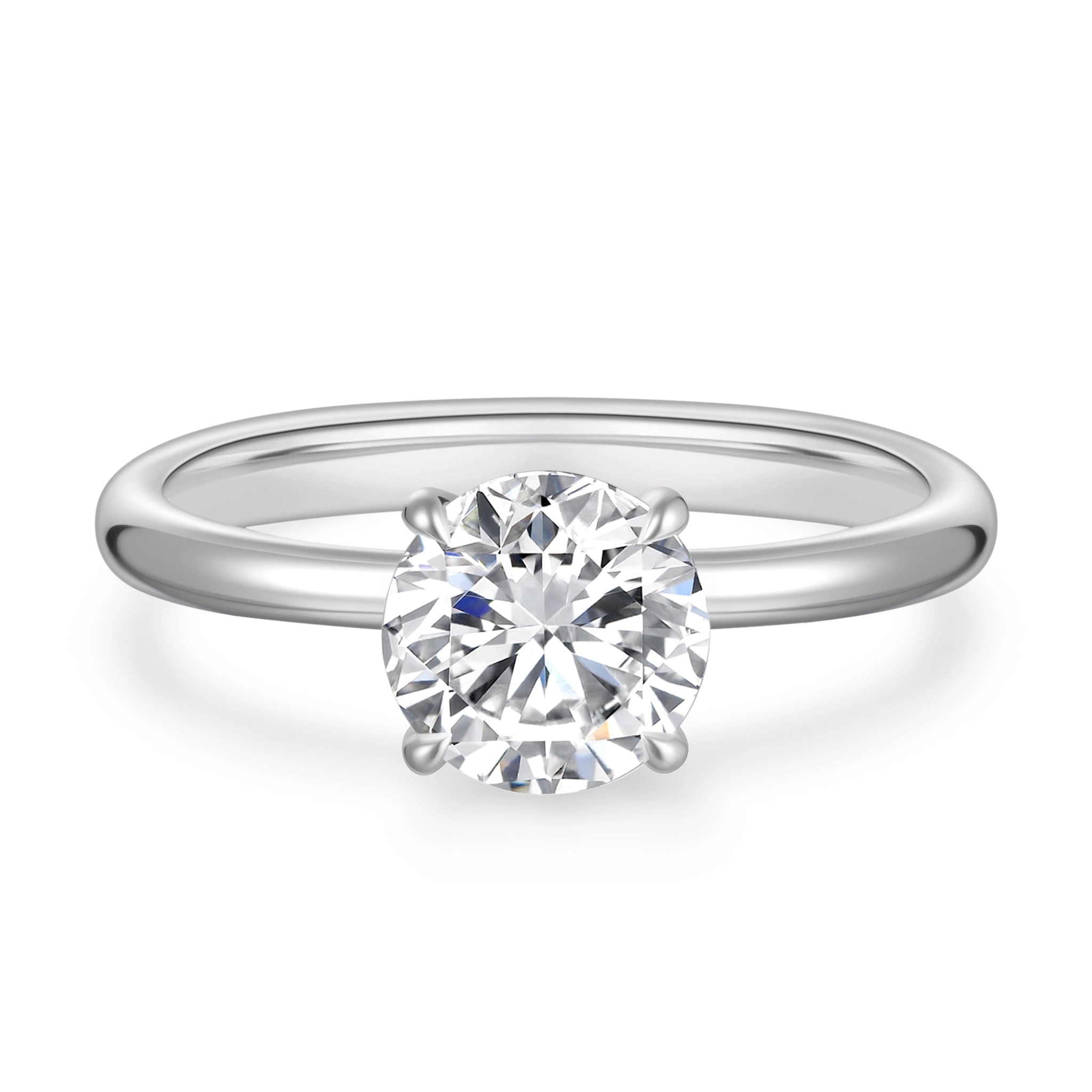 Front detail view of the J'ENCHANTE Petite 18K white gold lab-grown diamond ring, highlighting the round center diamond, four-prong setting and polished band.