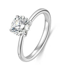 J'ENCHANTE Petite 18K white gold lab-grown diamond solitaire ring, shown on a white background with a round center diamond, four-prong setting and refined band.