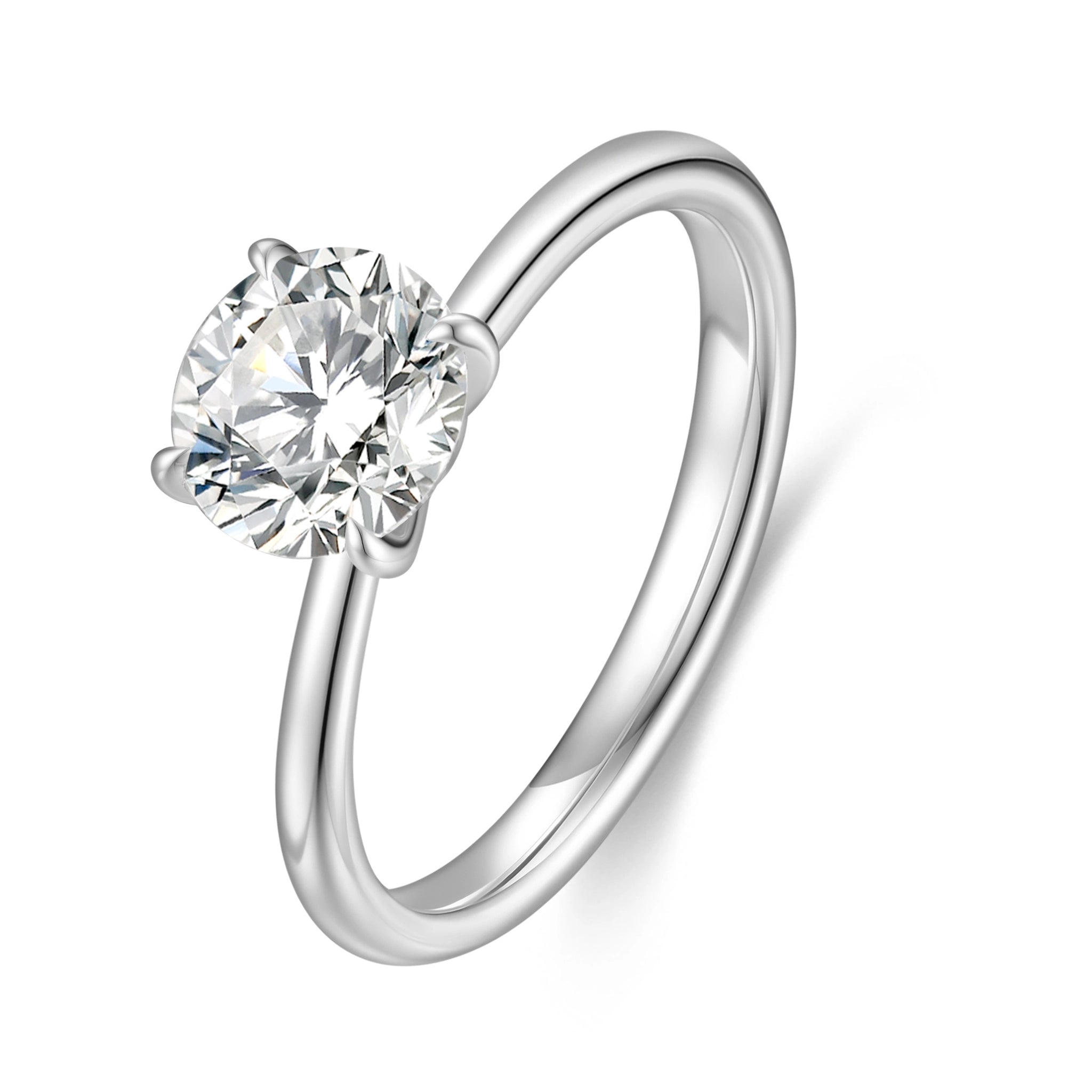 J'ENCHANTE Petite 18K white gold lab-grown diamond solitaire ring, shown on a white background with a round center diamond, four-prong setting and refined band.