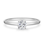 Front detail view of the J'ENCHANTE Soft Curve 18K white gold lab-grown diamond ring, highlighting the round center diamond, four-prong setting and polished band.