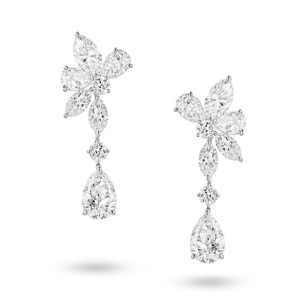 J'ENCHANTE The Celestia Drop earrings in 18K white gold, featuring pear, marquise and round diamonds, shown as a front-facing pair on a white background.