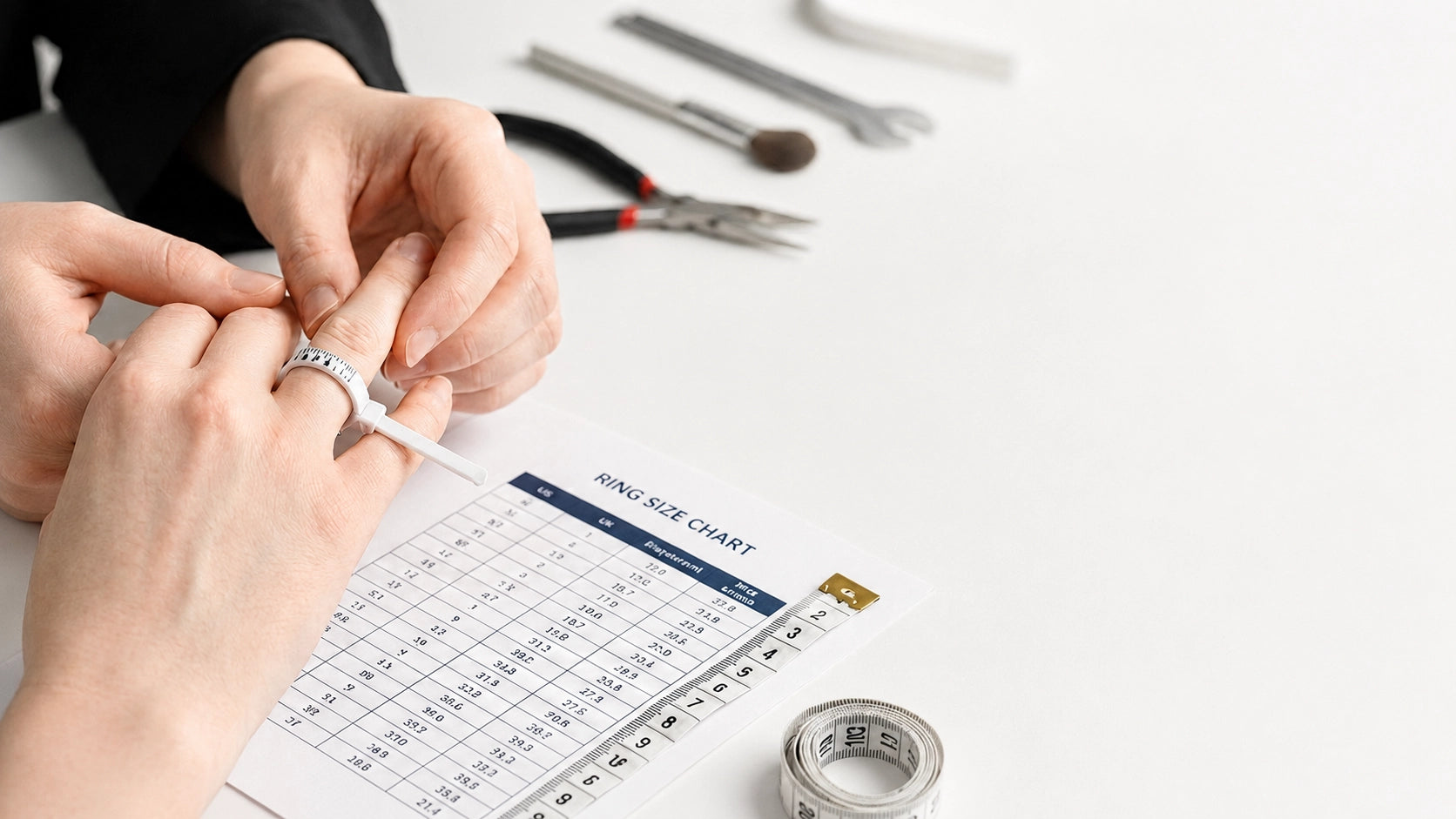 Measuring a ring size with sizing tools and a J’ENCHANTE ring size chart