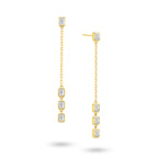Angled view of the J'ENCHANTE DEW 50mm emerald-cut diamond drop earrings. The image highlights the delicate gold chain and the sharp, composed facets of the step-cut diamonds. Balanced between precision and movement, this refined design offers graphic brilliance ideal for confident workwear or minimalist evening styling.