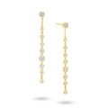 Angled view of the J'ENCHANTE DEW linear droplet diamond earrings. The image highlights the delicate gold setting and the precise vertical alignment of the round diamonds. Balanced between precision and movement, this design introduces a composed rhythm of light that perfectly complements confident workwear or formal looks.