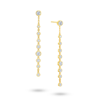 Angled view of the J'ENCHANTE DEW linear droplet diamond earrings. The image highlights the delicate gold setting and the precise vertical alignment of the round diamonds. Balanced between precision and movement, this design introduces a composed rhythm of light that perfectly complements confident workwear or formal looks.