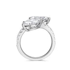 ide profile view of the J'ENCHANTE DUO double stone diamond ring in 18K white gold. Showcasing the secure setting and the open architectural gallery beneath the two 2-carat marquise diamonds. This refined support structure allows maximum light to pass through, dramatically enhancing the clarity and brilliance of the focal stones.