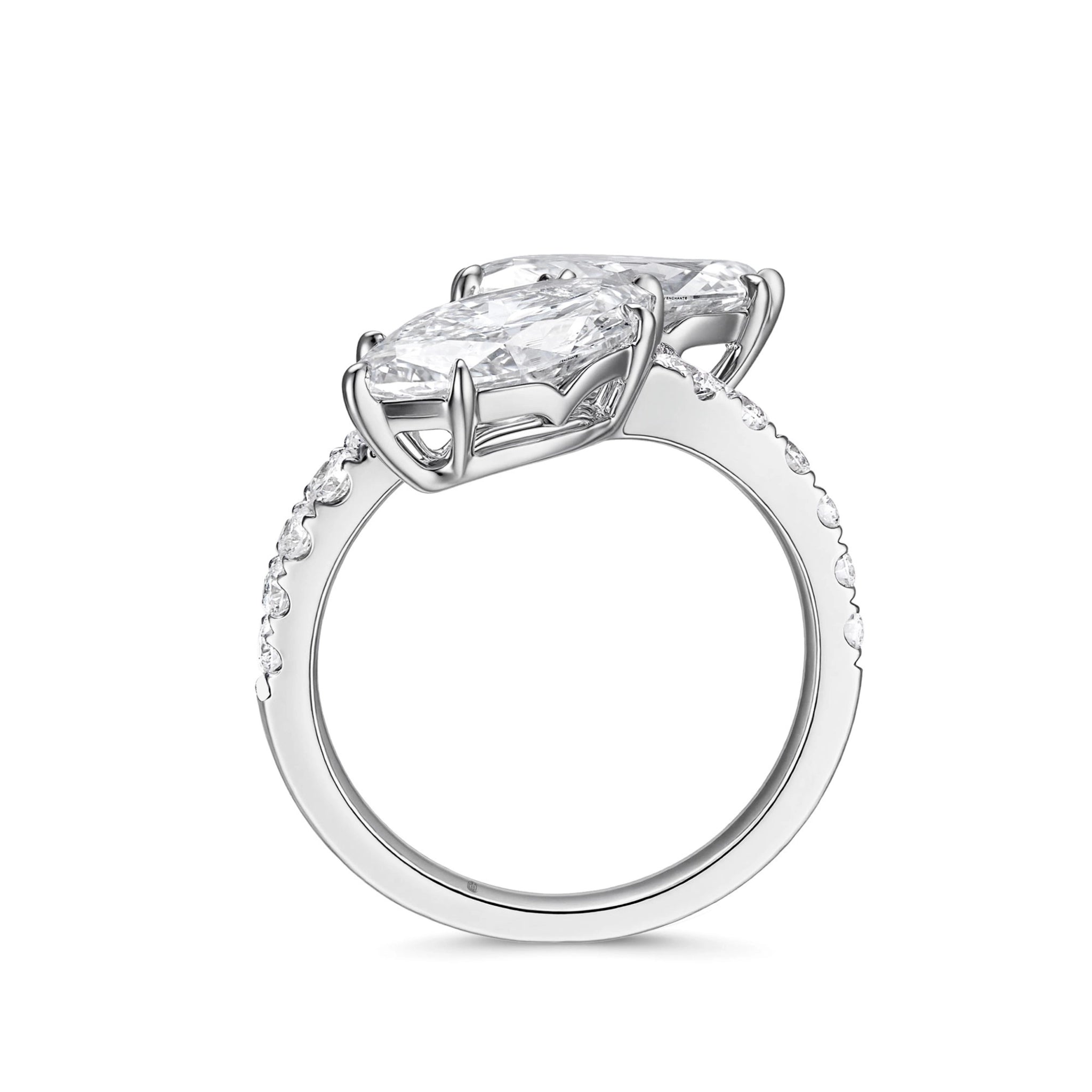 ide profile view of the J'ENCHANTE DUO double stone diamond ring in 18K white gold. Showcasing the secure setting and the open architectural gallery beneath the two 2-carat marquise diamonds. This refined support structure allows maximum light to pass through, dramatically enhancing the clarity and brilliance of the focal stones.