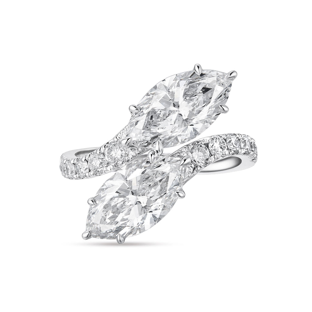 Top view of the J'ENCHANTE DUO double stone ring in 18K white gold. Featuring a graceful bypass design, the ring showcases two magnificent 2-carat marquise-cut diamonds. The fluid pavé-set band creates a sense of movement and sculptural balance, offering a bold yet refined "Toi et Moi" elegance.