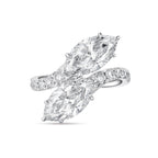 Top view of the J'ENCHANTE DUO double stone ring in 18K white gold. Featuring a graceful bypass design, the ring showcases two magnificent 2-carat marquise-cut diamonds. The fluid pavé-set band creates a sense of movement and sculptural balance, offering a bold yet refined "Toi et Moi" elegance.
