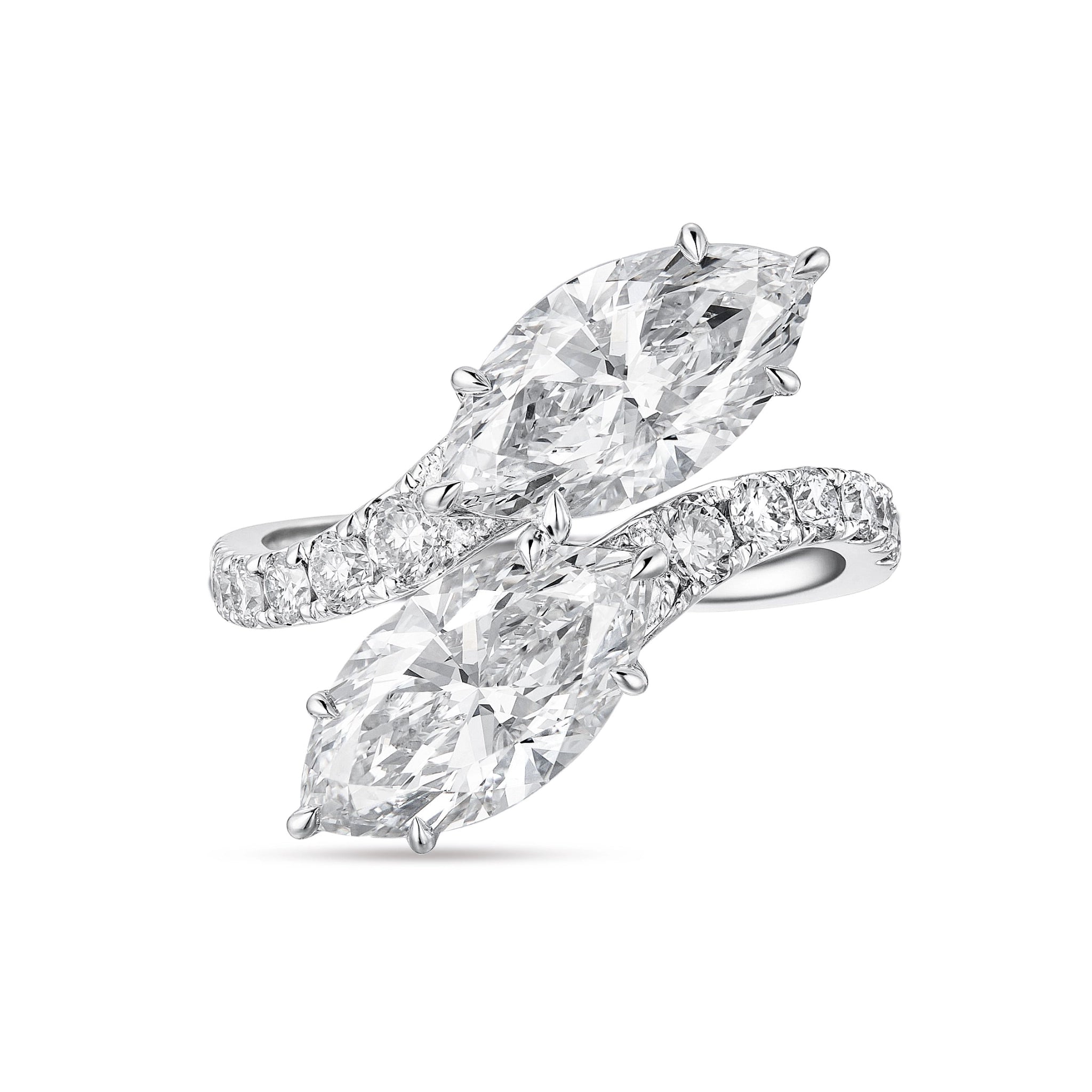 Top view of the J'ENCHANTE DUO double stone ring in 18K white gold. Featuring a graceful bypass design, the ring showcases two magnificent 2-carat marquise-cut diamonds. The fluid pavé-set band creates a sense of movement and sculptural balance, offering a bold yet refined "Toi et Moi" elegance.