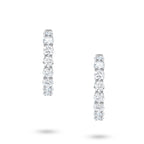 Front view of the J'ENCHANTE Full Light diamond hoop earrings in 18K white gold. Featuring a continuous circle of 26 round brilliant diamonds (approx. 4.40 carats), this design forms a seamless path of light around the ear. Free from excess embellishment, it allows the pure, elevated brilliance to speak for itself.