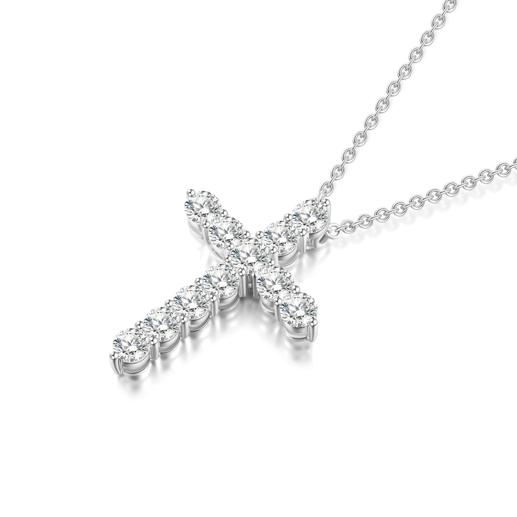 Angled view of the J'ENCHANTE HOPE 1.70ct diamond cross necklace. The perspective highlights the refined 18K white gold setting and the precise alignment of the round diamonds. This luminous design catches light from every angle, reflecting the collection's vision of offering radiant brilliance and a guiding beacon.