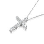 Angled view of the J'ENCHANTE HOPE 1.70ct diamond cross necklace. The perspective highlights the refined 18K white gold setting and the precise alignment of the round diamonds. This luminous design catches light from every angle, reflecting the collection's vision of offering radiant brilliance and a guiding beacon.