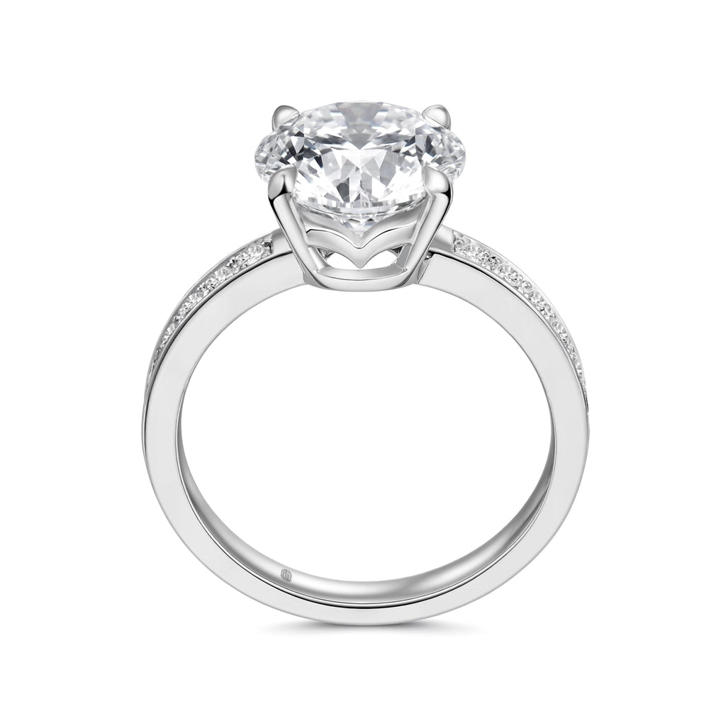 Upright profile view of the J'ENCHANTE JOY 2-carat pavé band diamond ring, displaying the elegant 18k white gold circular band and the elevated four-prong setting designed to maximize brilliance.
