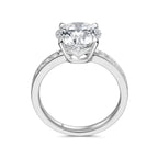 Upright profile view of the J'ENCHANTE JOY 2-carat pavé band diamond ring, displaying the elegant 18k white gold circular band and the elevated four-prong setting designed to maximize brilliance.

