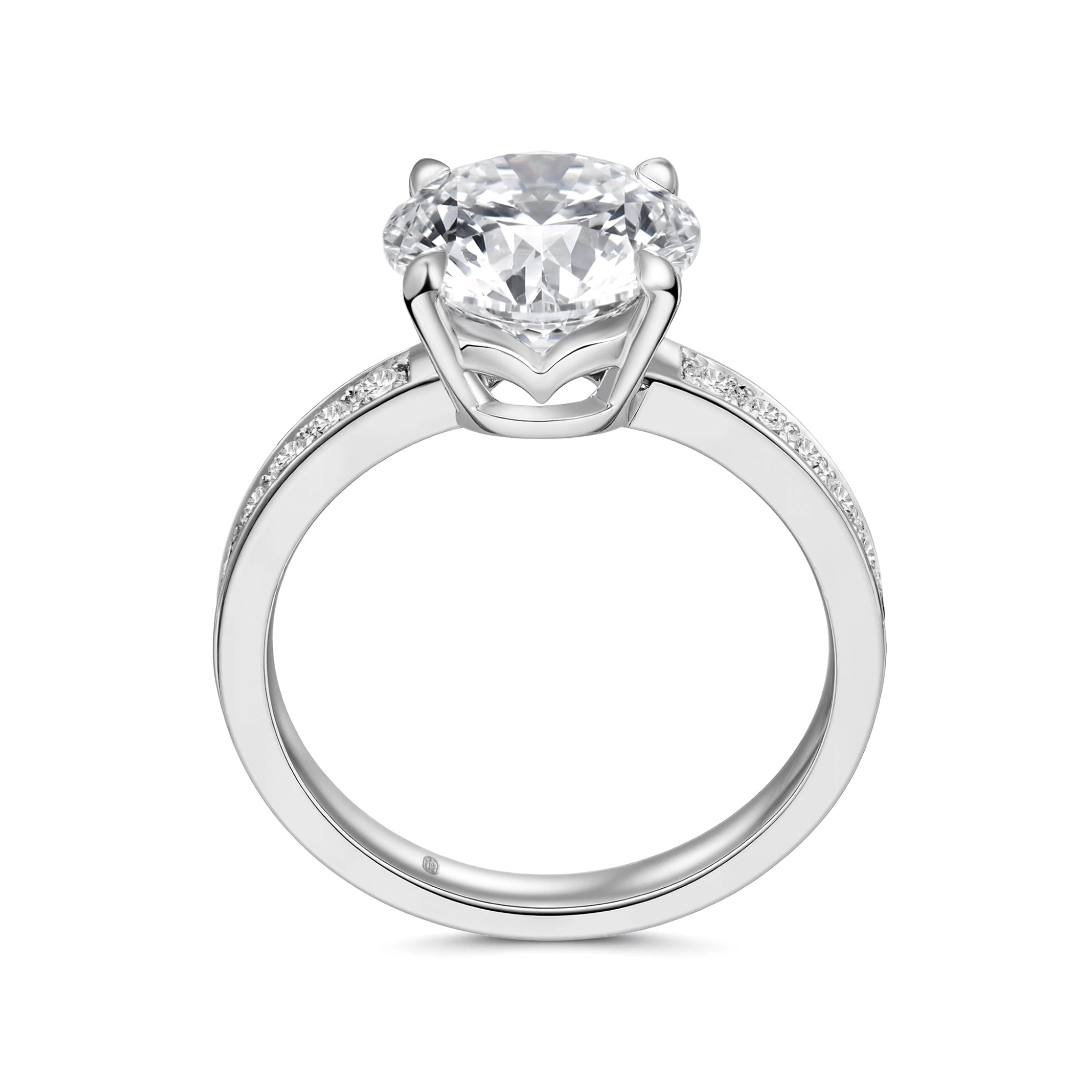 Upright profile view of the J'ENCHANTE JOY 2-carat pavé band diamond ring, displaying the elegant 18k white gold circular band and the elevated four-prong setting designed to maximize brilliance.
