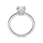 Upright profile view of the J'ENCHANTE JOY classic solitaire diamond ring, displaying the perfect circular band in sleek 18k white gold, the elevated J-Setting structure, and the signature brand hallmark.
