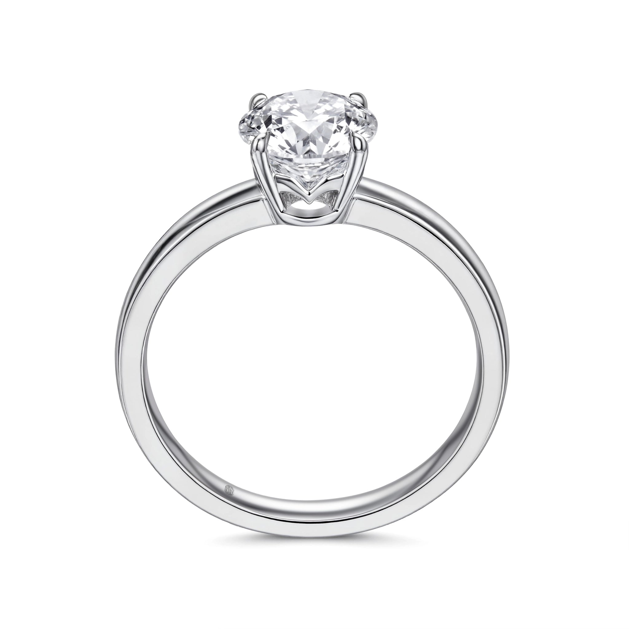 Upright profile view of the J'ENCHANTE JOY classic solitaire diamond ring, displaying the perfect circular band in sleek 18k white gold, the elevated J-Setting structure, and the signature brand hallmark.