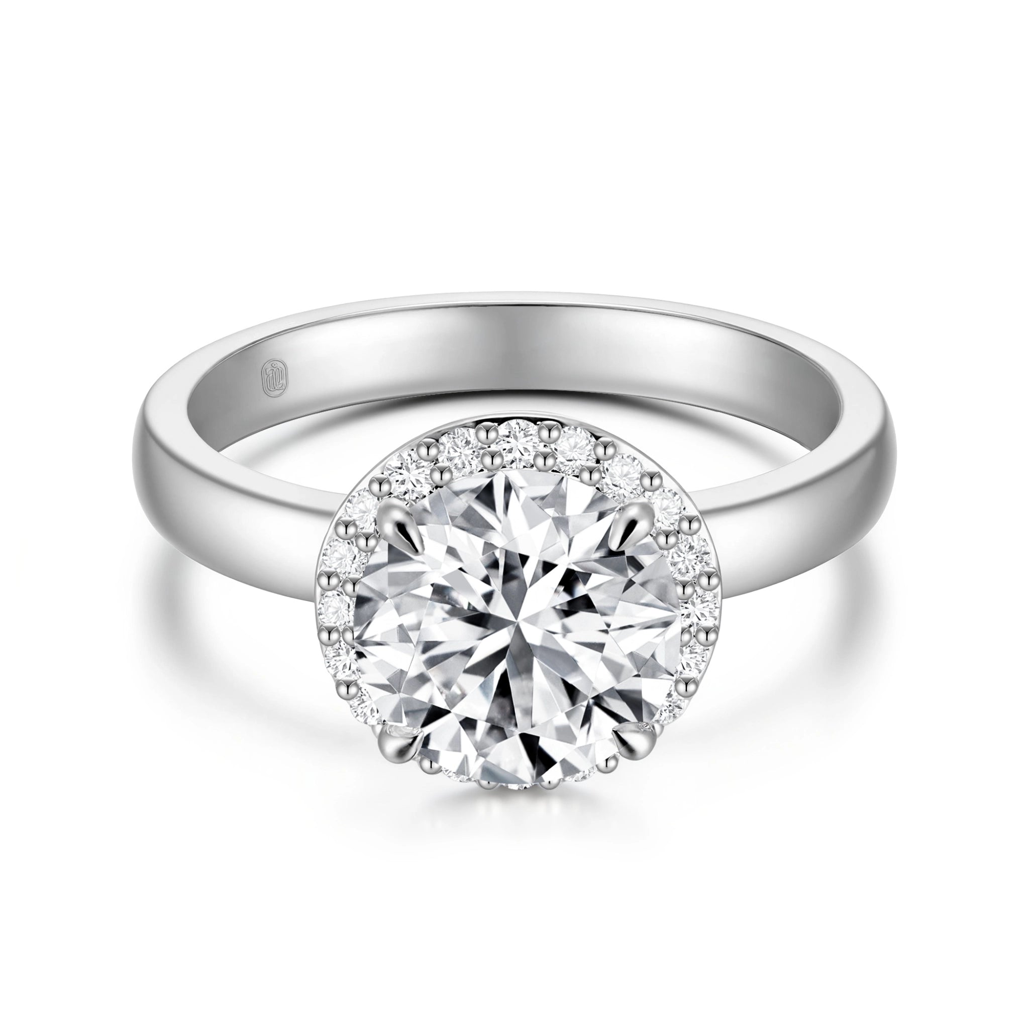 Top view of the J'ENCHANTE JOY halo solitaire diamond ring in 18K white gold, highlighting the brilliant center stone perfectly framed by a sparkling diamond halo, balanced by a clean, minimalist band.
