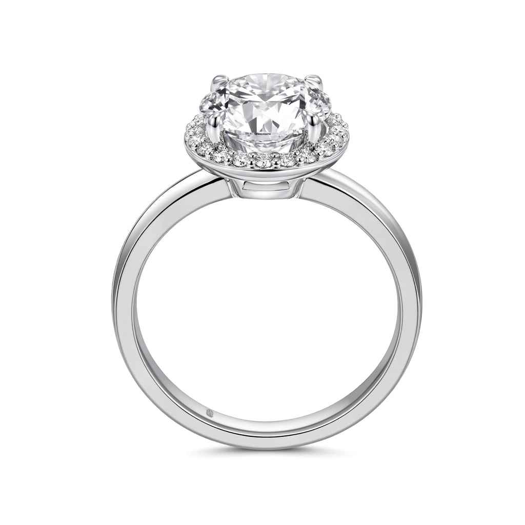 Upright profile view of the J'ENCHANTE JOY 18K white gold halo diamond ring, displaying the elegant circular band and the layered proportions of the four-prong setting and luminous 0.10-carat diamond halo.