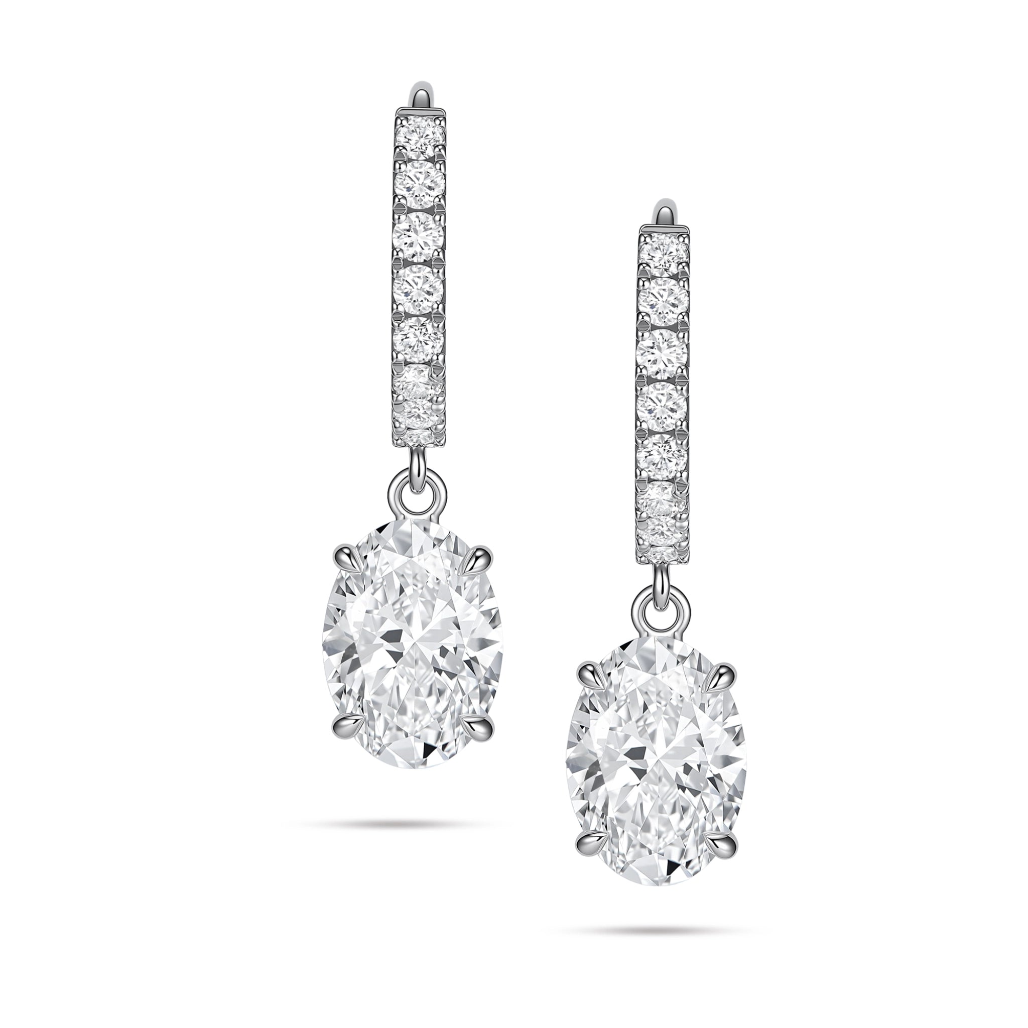 Front view of the J'ENCHANTE JOY oval drop earrings, featuring a pair of refined 18K white gold hoops adorned with 16 pavé-set diamonds (approx. 0.2 carats). The clean linear hoops create a beautiful, graceful contrast with the softly contoured, suspended oval diamond focal stones.