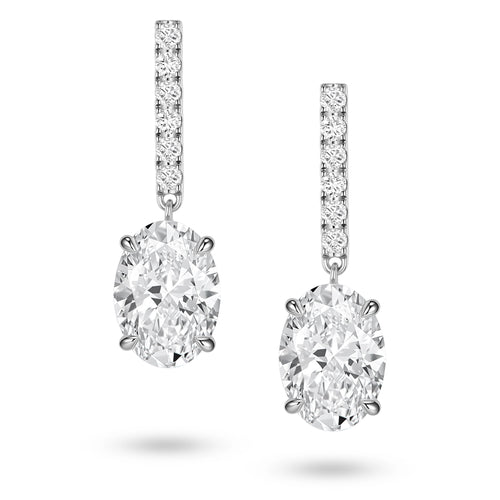 Front view of the J'ENCHANTE JOY oval bar stud earrings, featuring slim vertical bars pavé-set with 12 diamonds (0.2 carats) suspending softly contoured oval focal stones, creating a refined contrast of clean lines and graceful curves.