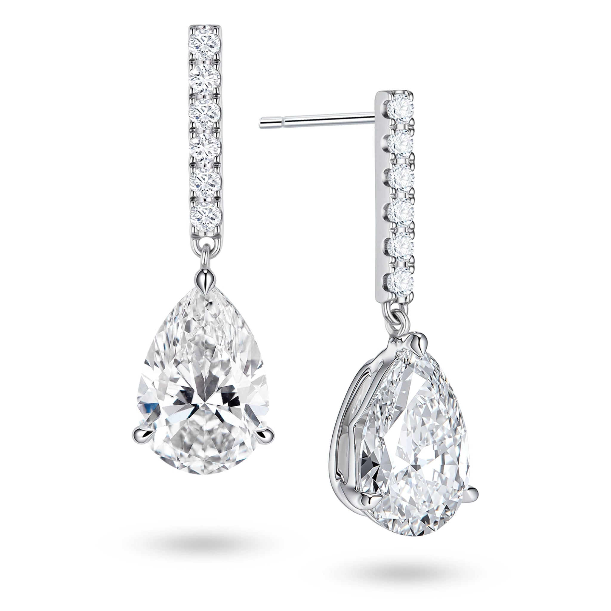 Angled view of the J'ENCHANTE JOY pear bar stud earrings, highlighting the secure stud post and the signature J-shaped side profile of the sculpted setting. This design maximizes side light entry to enhance the clarity and dimension of the pear-shaped drop.