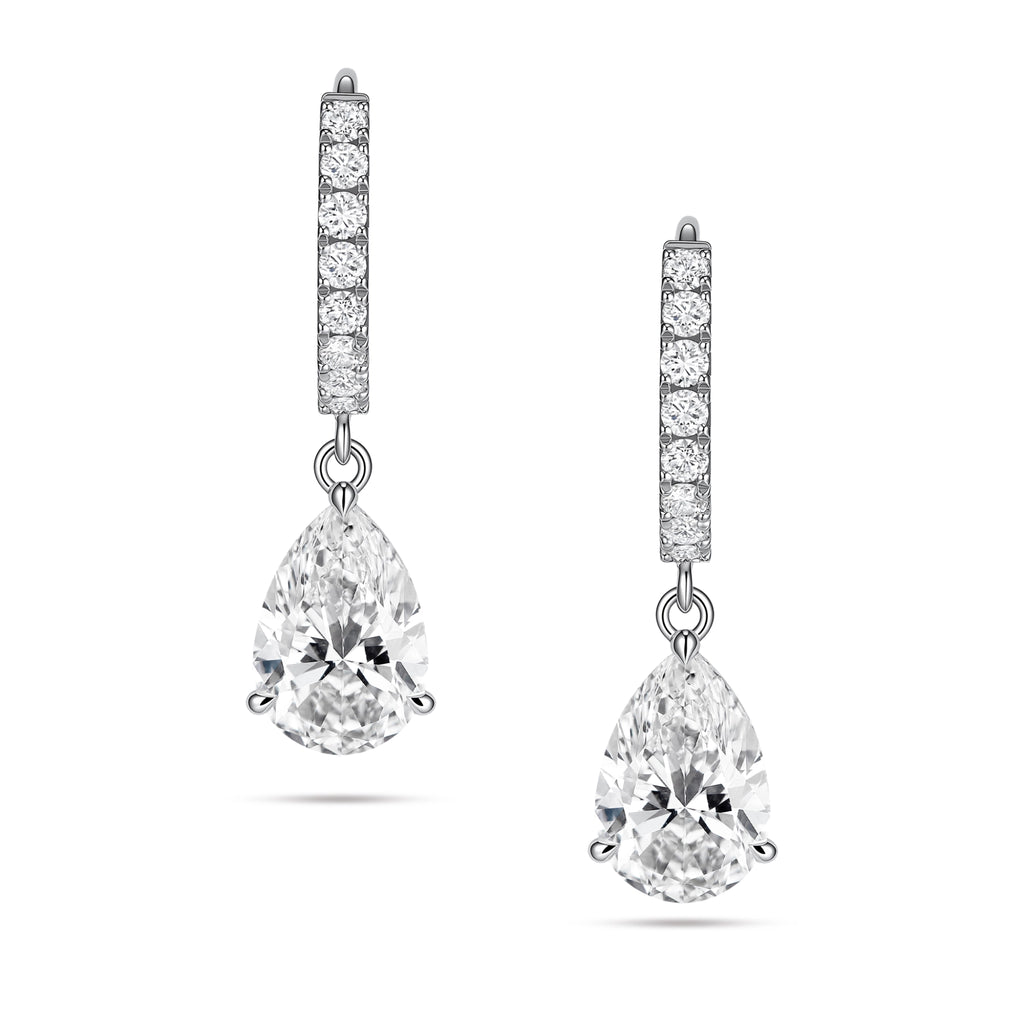 Front view of the J'ENCHANTE JOY pear drop earrings, featuring a pair of refined 18K white gold hoops adorned with 16 pavé-set diamonds (approx. 0.2 carats), creating a beautifully clean contrast with the luminous, suspended pear-shaped focal stones below.
