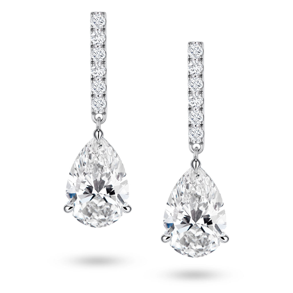 Front view of the J'ENCHANTE JOY pear bar stud earrings, featuring slim vertical bars pavé-set with 12 diamonds (0.2 carats) suspending graceful pear-shaped focal stones, creating a refined contrast of clean lines and elegant curves.
