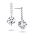 Angled view of the J'ENCHANTE JOY round bar stud earrings, highlighting the secure stud post and the signature J-shaped side profile of the sculpted setting, designed to maximize side light entry and enhance the center diamond's dimension.