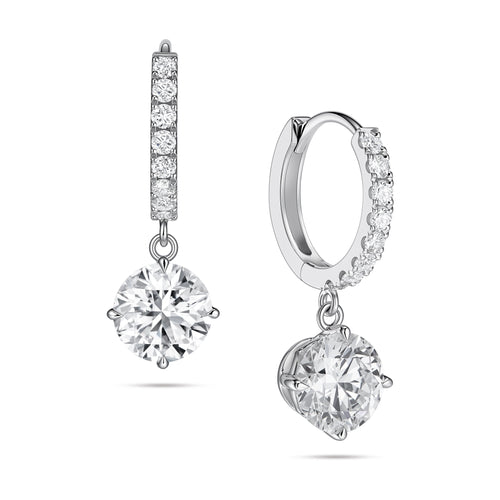 Angled view of the J'ENCHANTE JOY round drop earrings in 18K white gold, showcasing a pair of slim pavé hoops and brilliant round drops. One earring highlights the signature J-shaped side profile, designed to maximize side light entry for enhanced diamond clarity and depth.