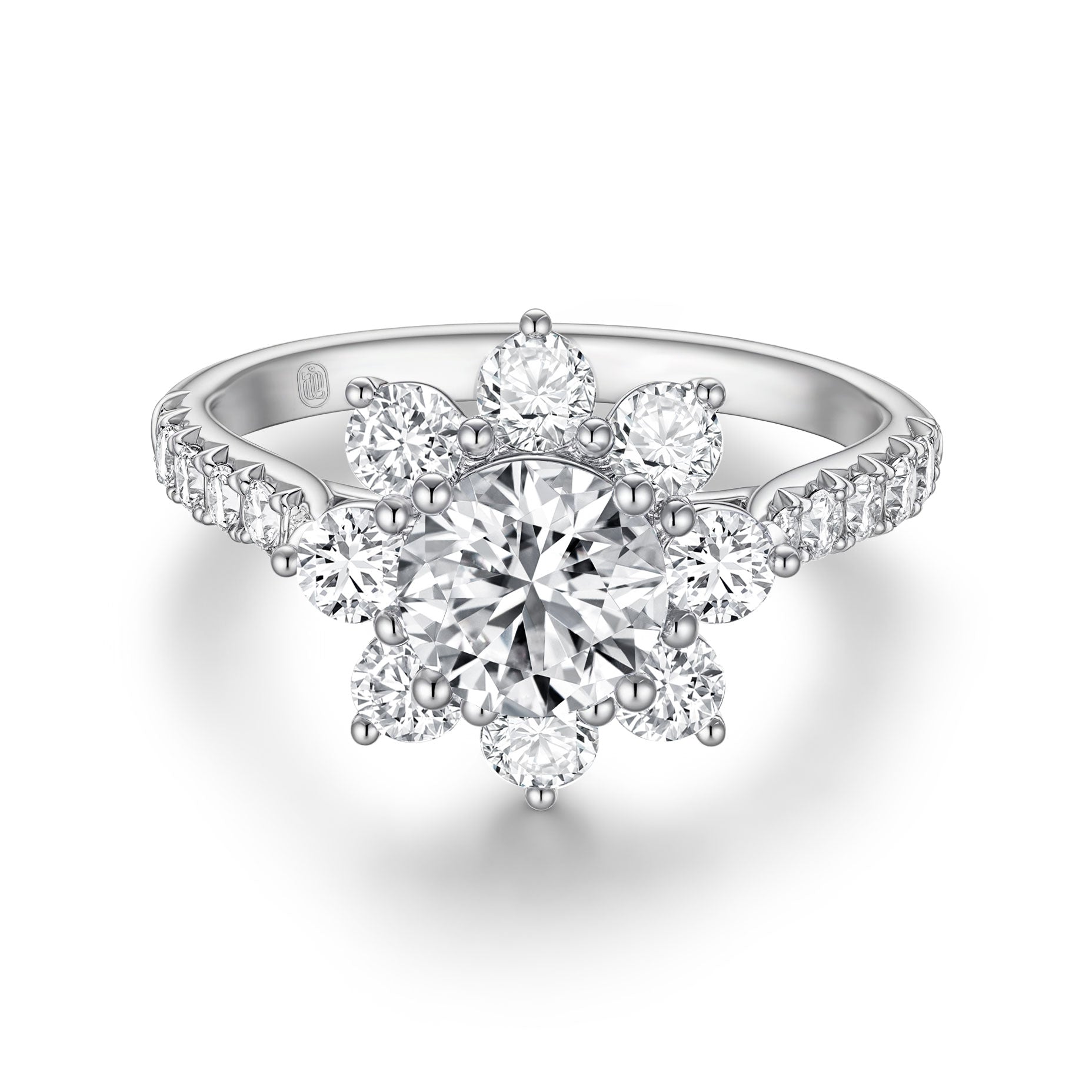 Front view of the J'ENCHANTE LIFE Full Bloom diamond ring in white gold. A commanding 1-carat round center diamond is encircled by a radiant sunflower-inspired halo. Paired with a delicately pavé-set band featuring 22 round diamonds (approx. 1.0 carats), the design creates a stunning, luminous floral silhouette.