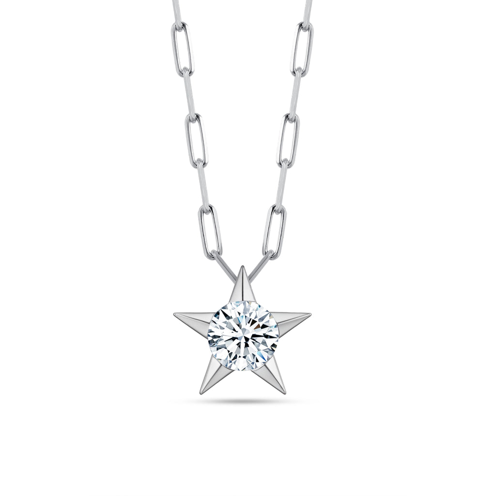 Front view of the J'ENCHANTE LUCK reversible star charm necklace in 18K white gold. Showcasing the brilliant side of fortune, the sculptural star pendant features a 0.5-carat round center diamond. Suspended on a modern paperclip link chain, it acts as a shining symbol of guidance and hope.
