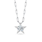 Front view of the J'ENCHANTE LUCK reversible star charm necklace in 18K white gold. Showcasing the brilliant side of fortune, the sculptural star pendant features a 0.5-carat round center diamond. Suspended on a modern paperclip link chain, it acts as a shining symbol of guidance and hope.