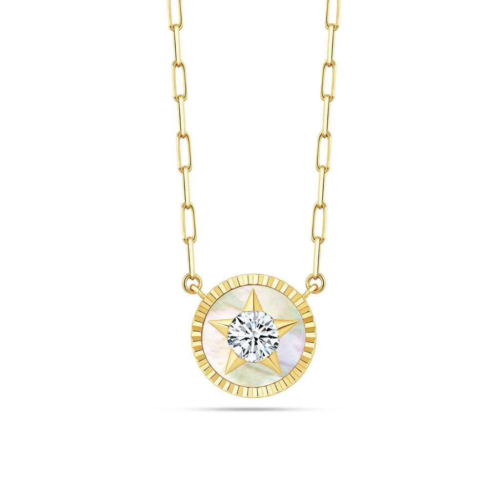 Front view of the J'ENCHANTE LUCK reversible star medallion necklace in 18K gold, featuring a 0.2ct diamond set within a radiant mother-of-pearl star, symbolizing guidance and hope on a modern gold paperclip chain.
