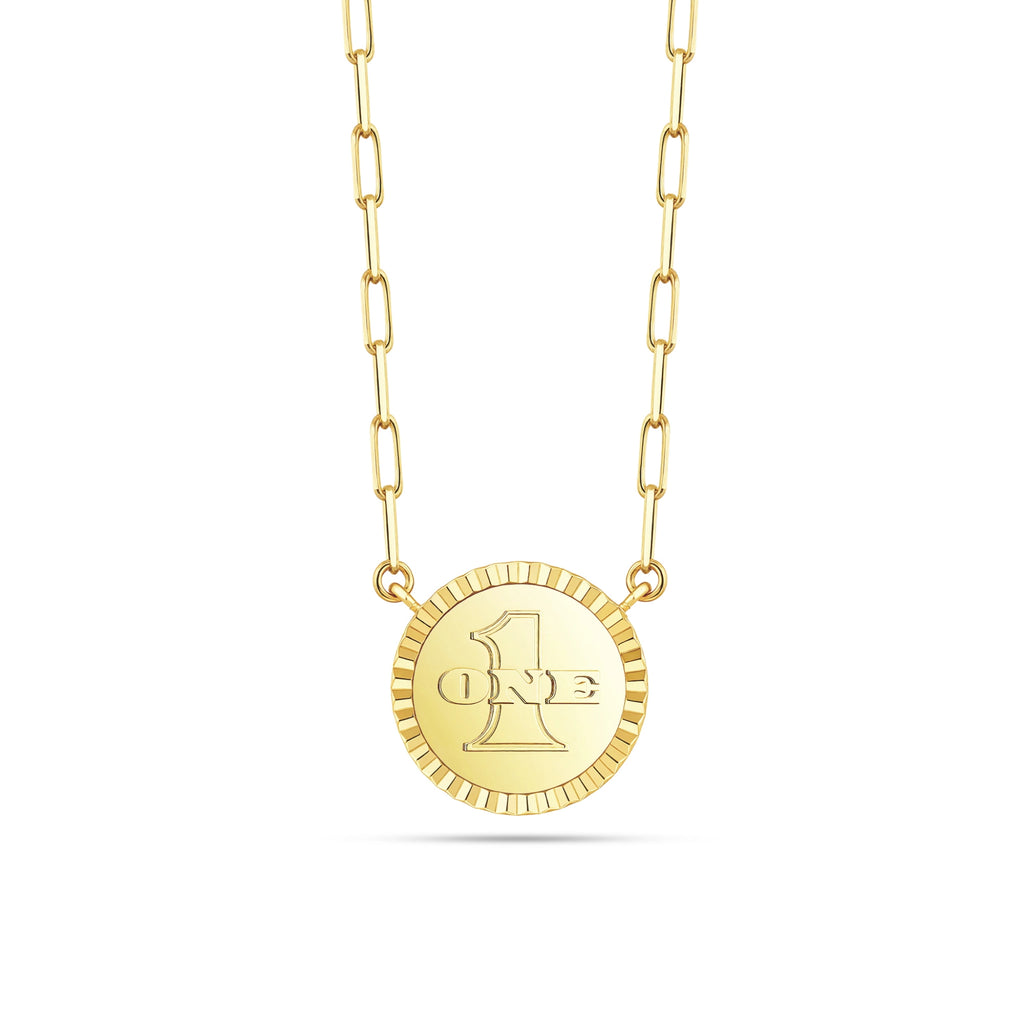Reverse view of the J'ENCHANTE LUCK reversible star necklace, featuring an iconic embossed "ONE" logo on 18K gold. This versatile, reversible design allows for a seamless transition from a diamond-accented star to a sophisticated minimalist medallion.