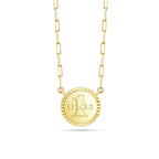 Reverse view of the J'ENCHANTE LUCK reversible star necklace, featuring an iconic embossed "ONE" logo on 18K gold. This versatile, reversible design allows for a seamless transition from a diamond-accented star to a sophisticated minimalist medallion.