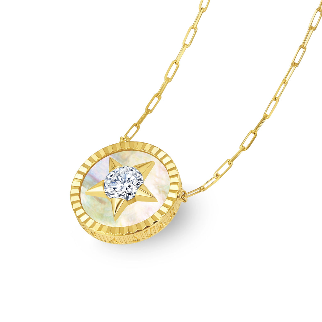 tylized view of the J'ENCHANTE LUCK star diamond medallion on a modern 18K gold paperclip chain, demonstrating how this versatile piece elevates both everyday professional and evening attire.