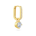 Angled view of the J'ENCHANTE MOD small 0.5-carat pavé round diamond drop hoop earring, highlighting the exquisite pavé setting on the 18k gold hoop and the secure, refined setting of the round brilliant focal stone.