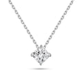 Front view of the J'ENCHANTE ONE cushion-cut diamond solitaire necklace. Suspended on a white gold chain, the brilliant cushion diamond is uniquely kite-set (compass set) to create a striking geometric silhouette. The refined single-stone design allows light to flow naturally, emitting a quiet yet confident brilliance.