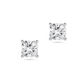 Front view of the J'ENCHANTE ONE cushion-cut diamond stud earrings in white gold. The minimalist design features a brilliant cushion-cut diamond on each ear. The soft, rounded corners of the cushion cut offer a pure vision of form, light, and balance for timeless everyday elegance.