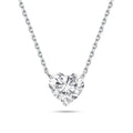 Front view of the J'ENCHANTE ONE heart-cut diamond solitaire necklace in white gold. Centered on a perfectly balanced, brilliant heart-shaped stone, the pure and minimalist design captures light effortlessly, offering a romantic and unmistakable statement of elegance.